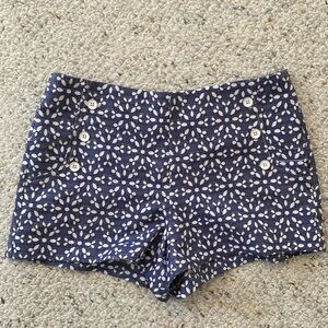 Cute shorts with blue/white flower design. Front Button detail on both sides